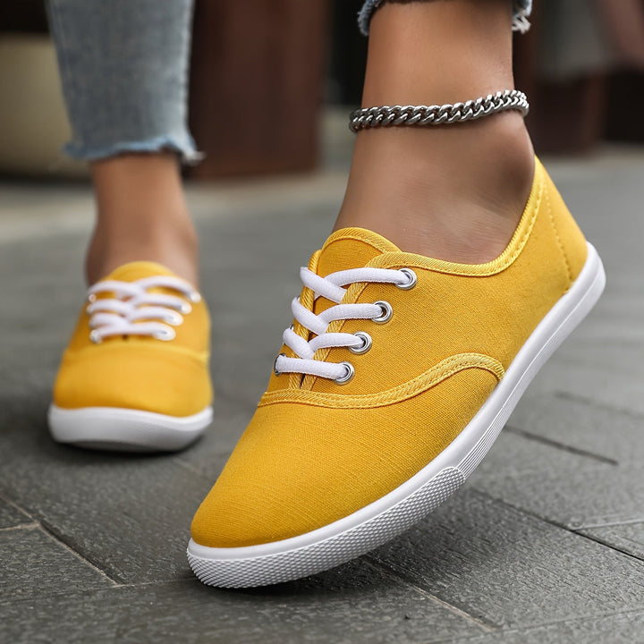 Everyday women's low canvas shoes, featuring a comfortable design and secure lace-up fit for casual style.