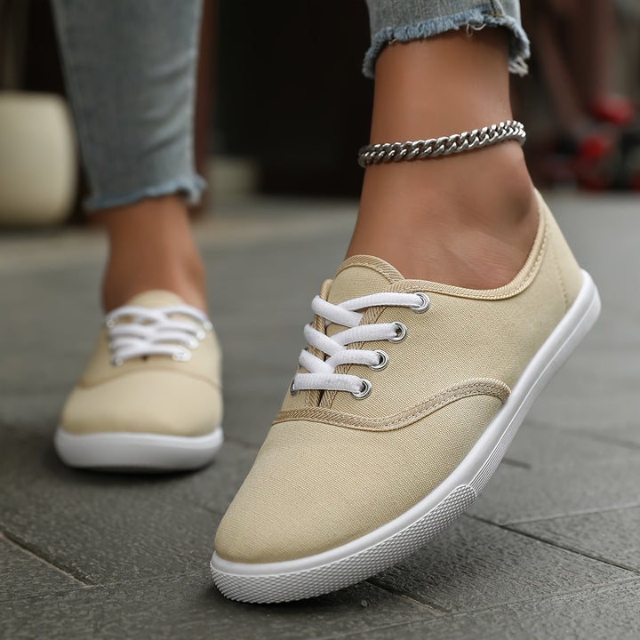 Soft, comfortable women's low-top canvas shoes with sturdy lace-up closure for all-day wear.
