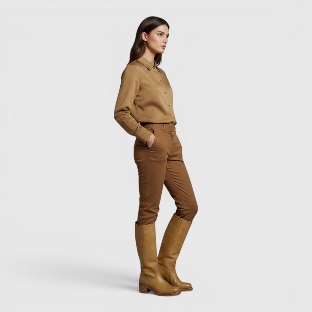 Woman walking in versatile mid-calf orthopaedic fall boots, comfortable for all-day wear & autumn fashion.