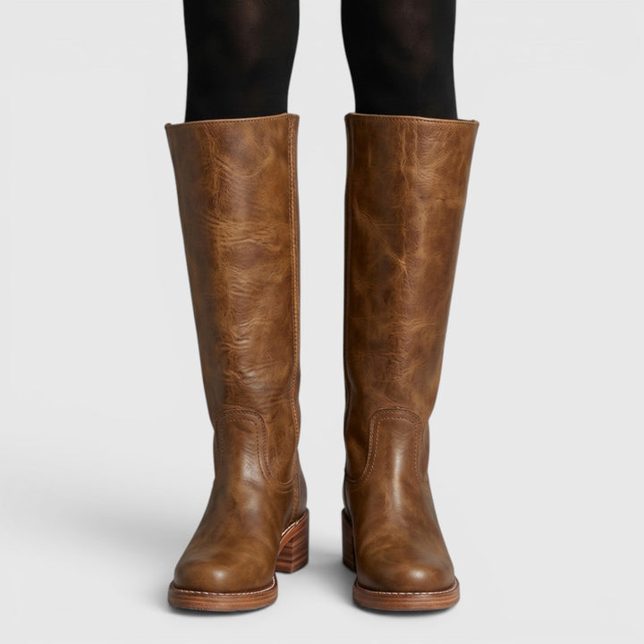 Plush interior lining of comfortable women's mid-calf orthopaedic fall boots, ensuring warmth & support.
