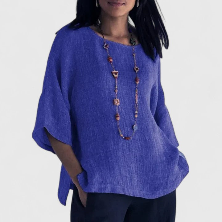 Elegant blue women's O-neck blouse, versatile & stylish with three-quarter sleeves for any occasion.