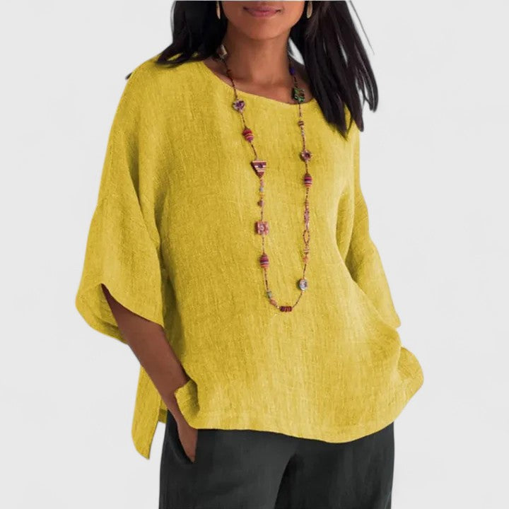 Yellow women's comfortable O-neck blouse featuring three-quarter sleeves & a versatile relaxed fit.