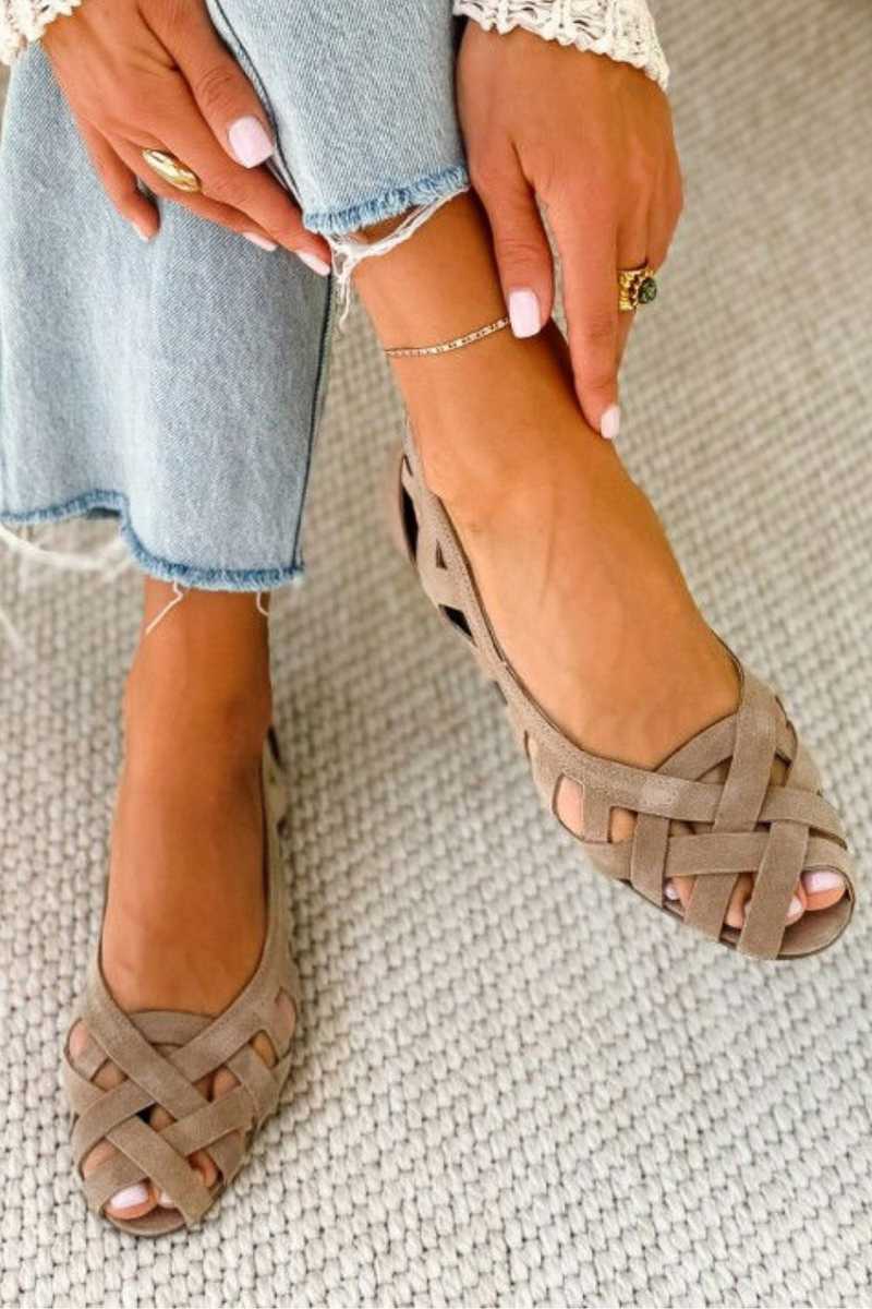 Essential women's summer footwear: comfortable flat open toe sandals with stylish cross straps.