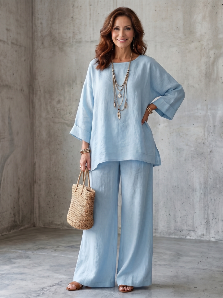 Women's relaxed fit two-piece set: long oversized tunic and elastic waist wide-leg pants.