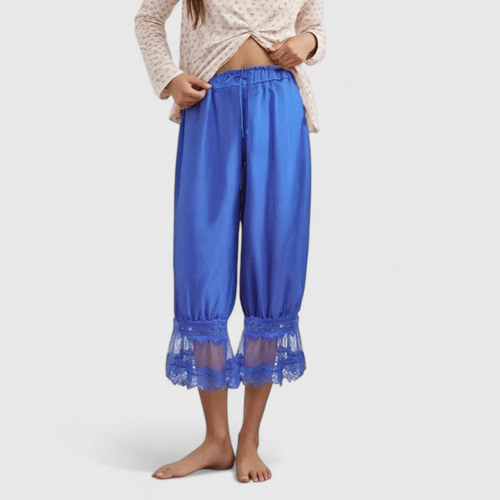 Elegant women's loose-fit lace pants with modern patchwork, designed for comfort and contemporary style.