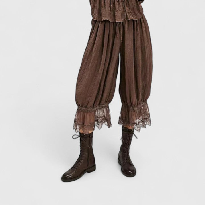 Relaxed fit women's fashion trousers, featuring chic lace panels and comfortable patchwork fabric.