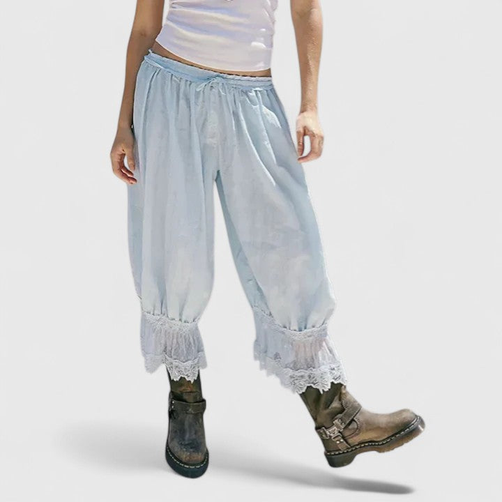 Fashionable women's casualwear trousers: mid-rise, loose-fit, showcasing unique patchwork and lace.
