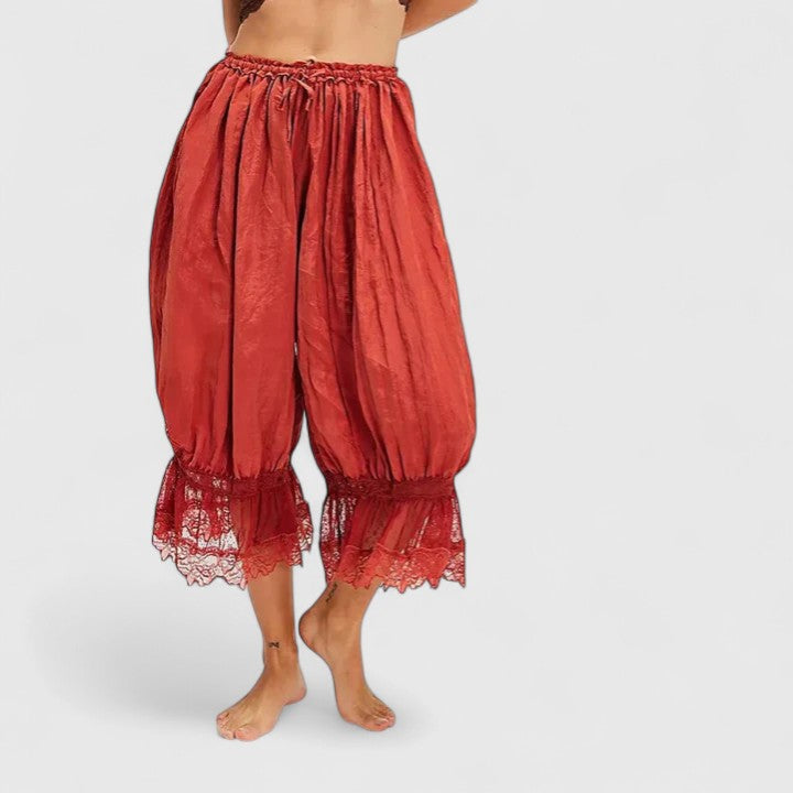 Women's streetwear pants with artistic patchwork and delicate lace accents, offering ultimate comfort.