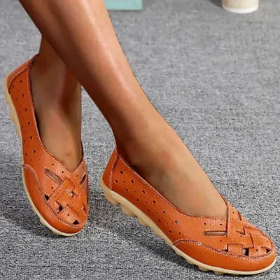 Low-cut perforated women's slip-on loafers. Comfortable casual flat shoes with gripped sole for everyday wear.
