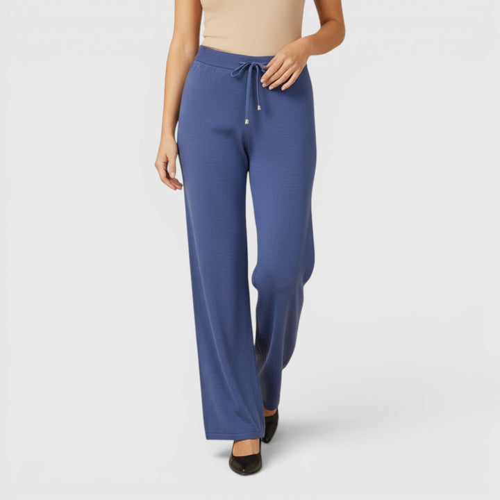 Chic women's relaxed fit pants, ankle length, ideal for comfortable lounging & casual elegance.