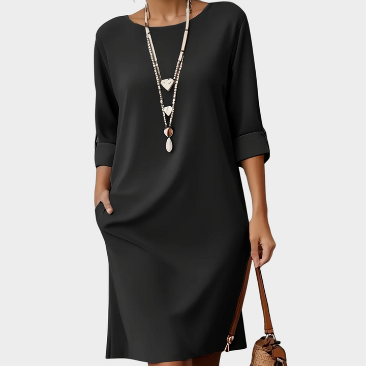 Versatile women's round neck midi dress, ideal for elegant spring fashion & comfortable summer days.