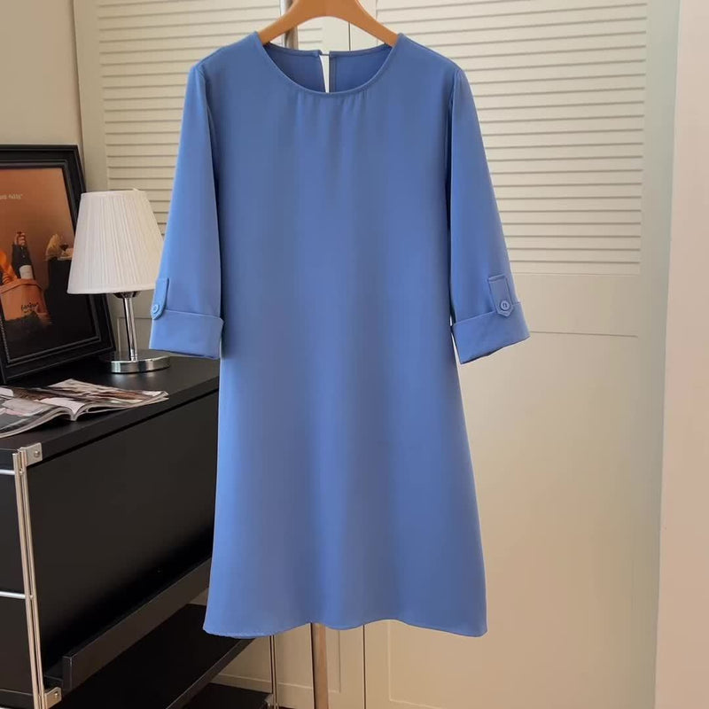 Stylish women's round neck midi dress, a versatile piece for elegant spring fashion and comfortable styling.