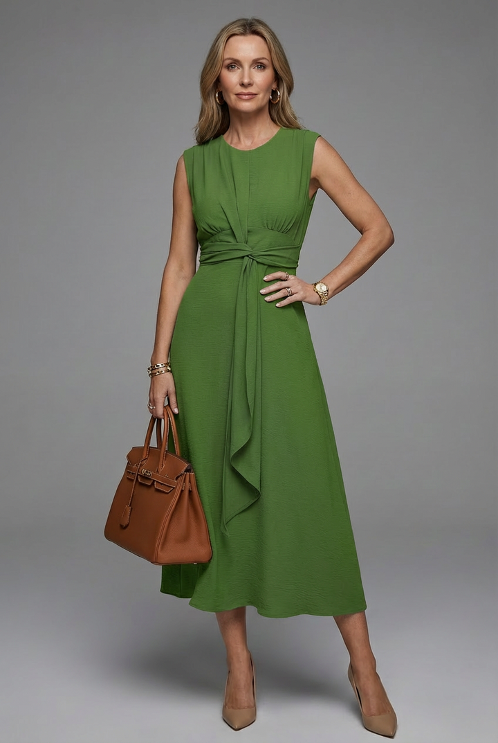 Timeless women's sleeveless midi dress, comfortable round neck design, a chic addition to spring fashion.