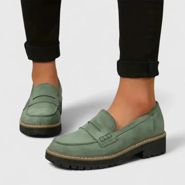 Blue women's comfortable flats with orthopaedic arch support, versatile slip-on shoes for work or leisure.