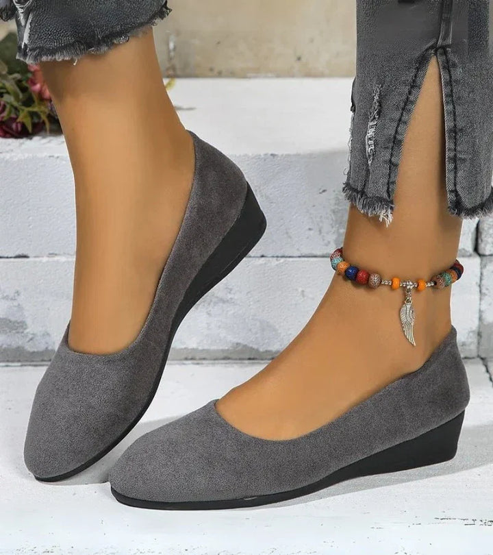 Stylish women's slip-on round toe low wedge shoes, designed for comfort and effortless everyday casual wear.