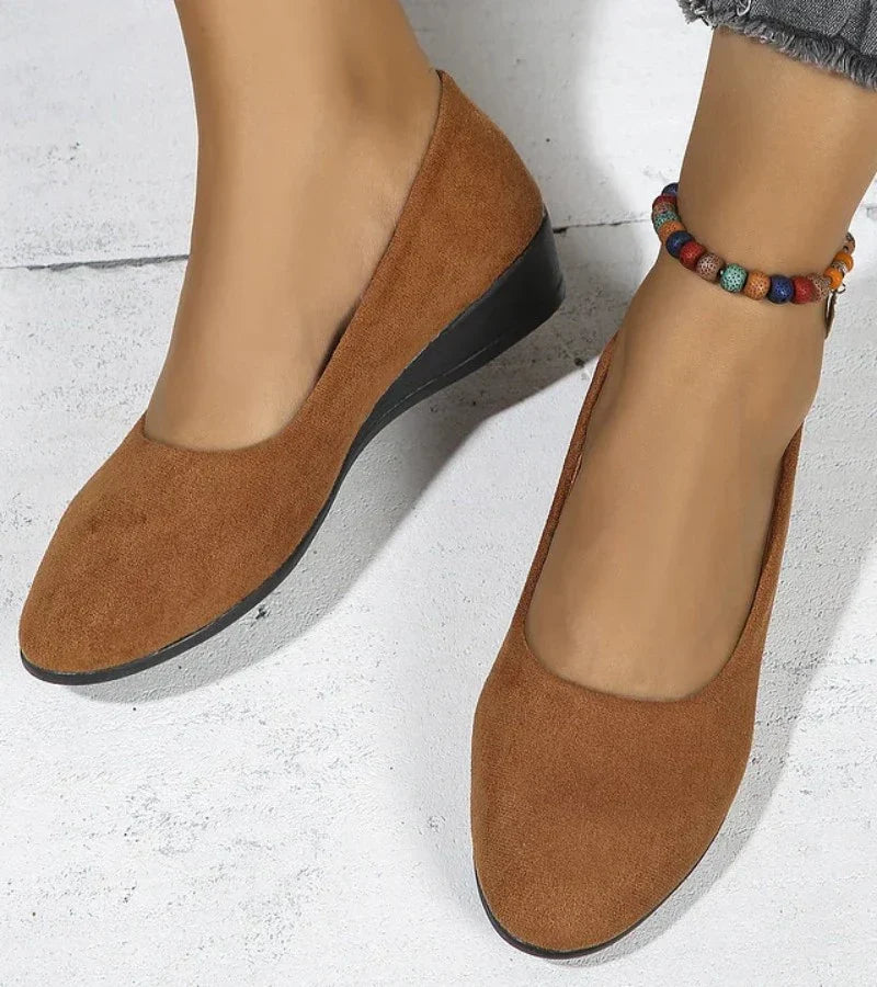 Women's round toe slip-on shoes with a comfortable low wedge heel, perfect casual footwear for easy wear.