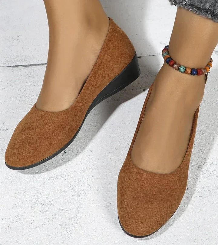 Women's round toe slip-on shoes with a comfortable low wedge heel, perfect casual footwear for easy wear.