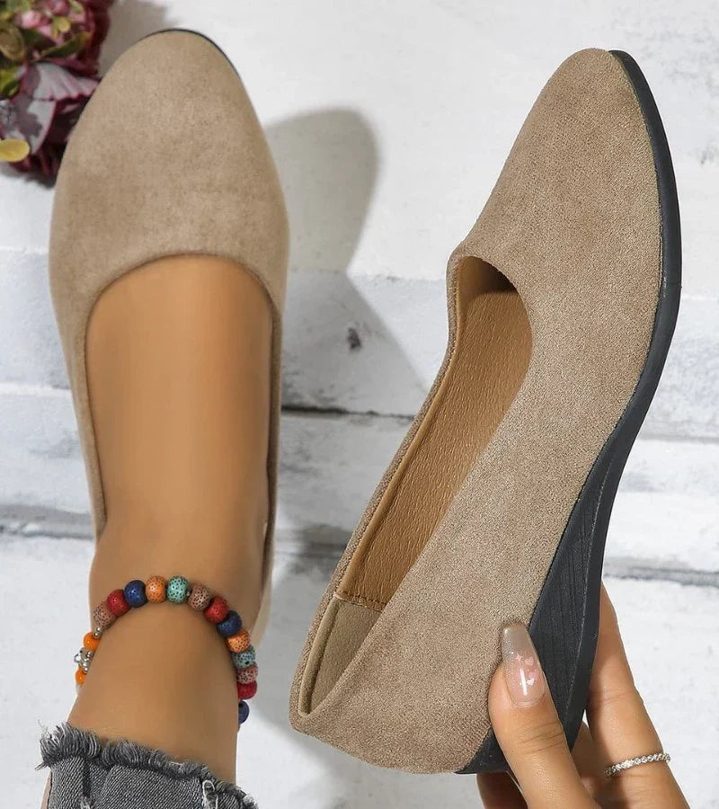 Fashionable women's low wedge slip-on shoes with a round toe, offering comfort for casual and everyday activities.