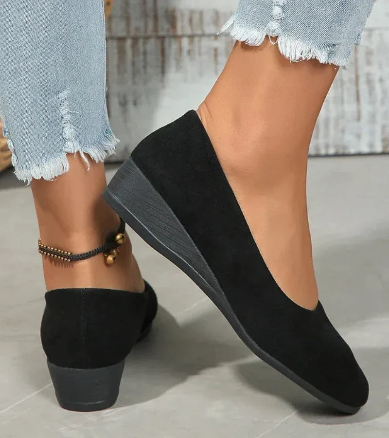 Comfortable women's casual slip-on low wedge shoes with a round toe, great for spring, summer, and autumn outfits.