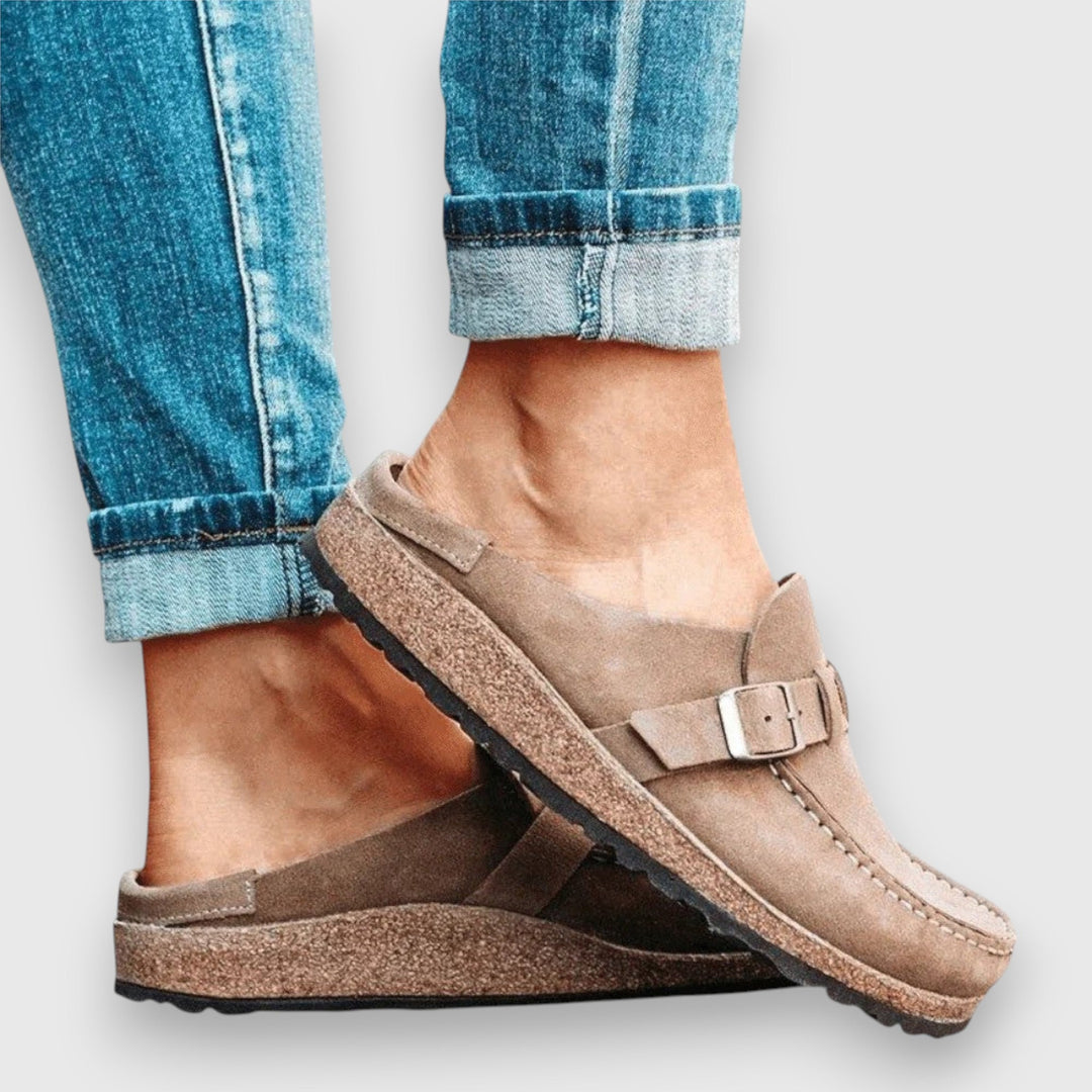 Women's comfortable slip-on sandals with ergonomic arch support, ideal for everyday casual wear.