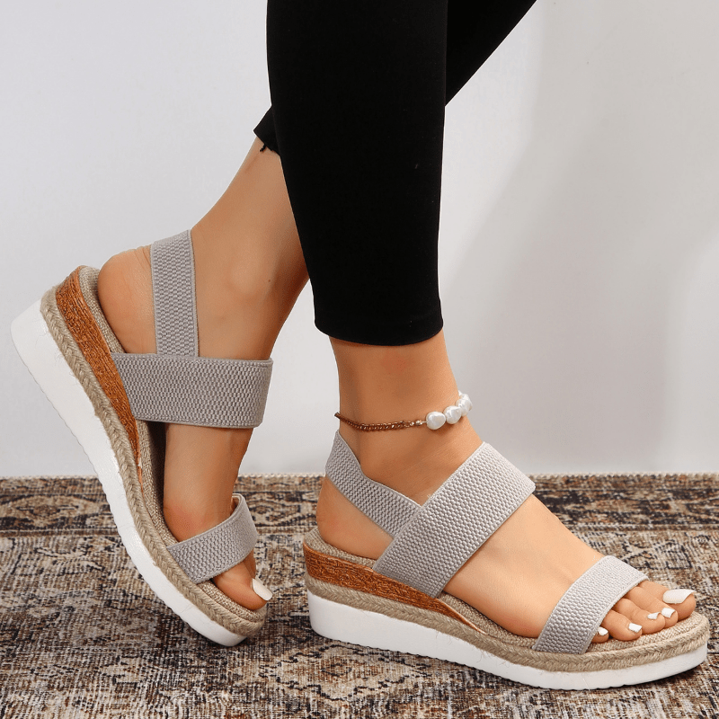 Step out in style with these women's platform stretch sandals.