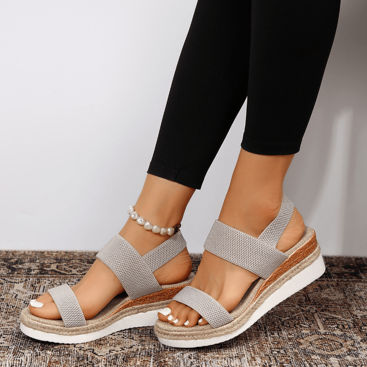Durable and fashionable women's slip-on sandals with platform heel.