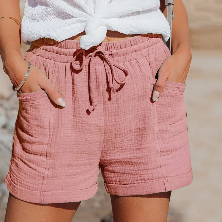 Green comfortable women's summer shorts featuring an adjustable waist & relaxed fit. Great for versatile everyday wear.