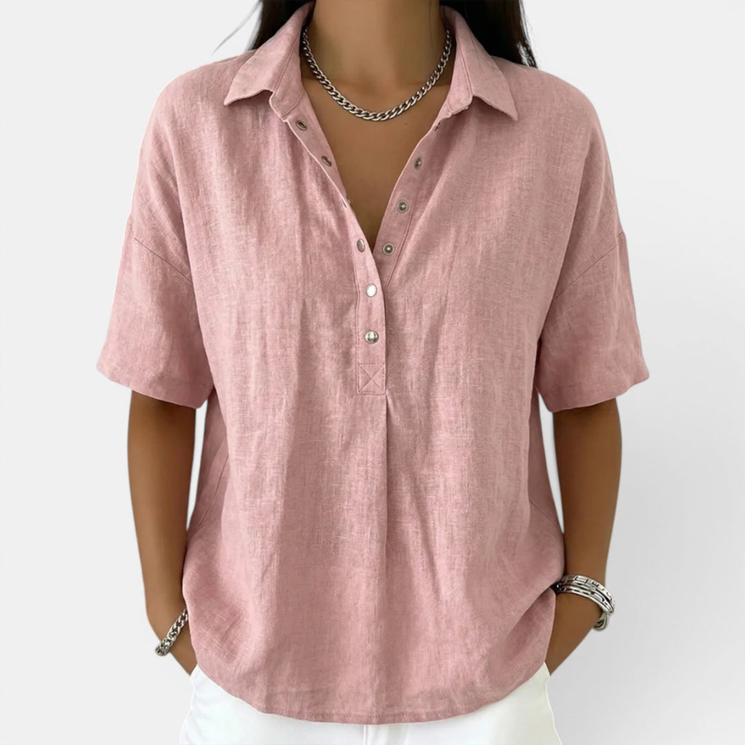 Versatile women's short sleeve V-neck blouse styled for a casual yet elegant look. Comfortable everyday women's fashion top.