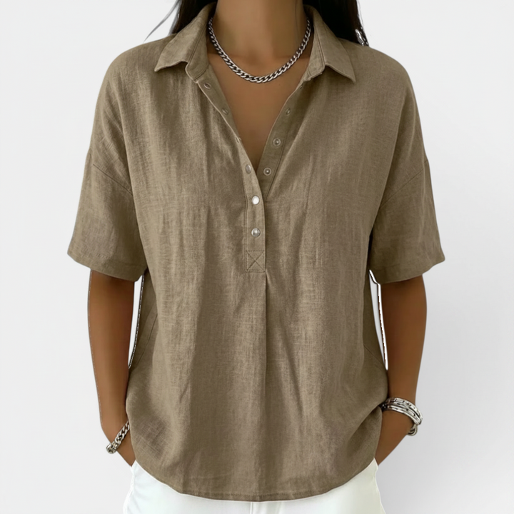 Comfortable women's V-neck short sleeve blouse, showcasing soft fabric texture for an elegant, everyday women's top.