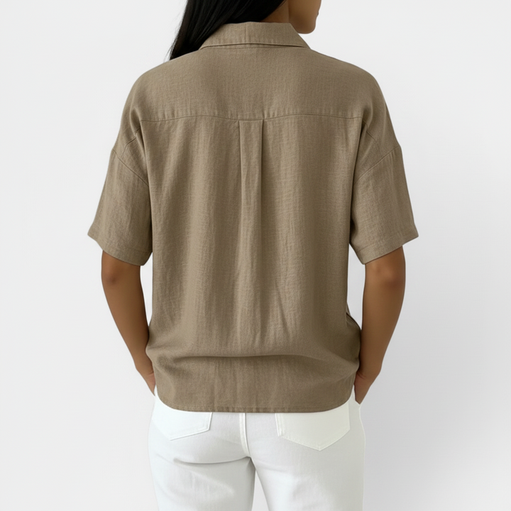 Stylish women's short sleeve V-neck blouse in a classic color, comfortable and elegant for any women's fashion occasion.