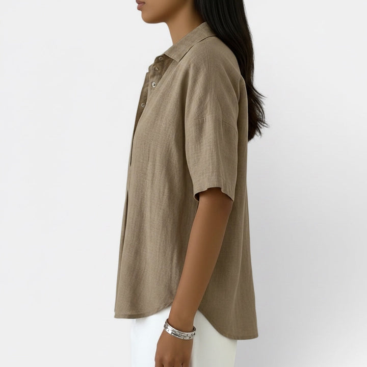 Women's elegant V-neck blouse with short sleeves, ideal for comfortable daily wear. A versatile women's shirt top.