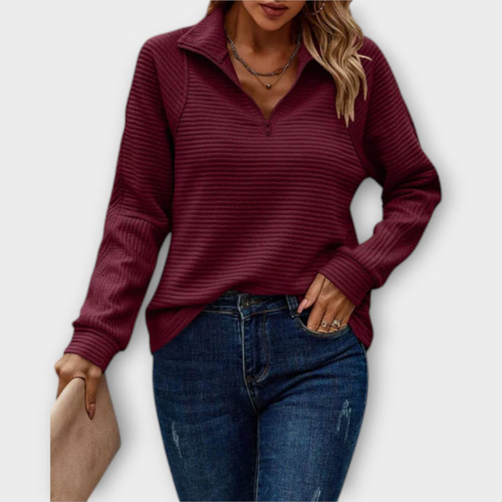 Comfortable women's V-neck knit jumper with zipper. Long sleeve pullover sweater, perfect for casual elegance.