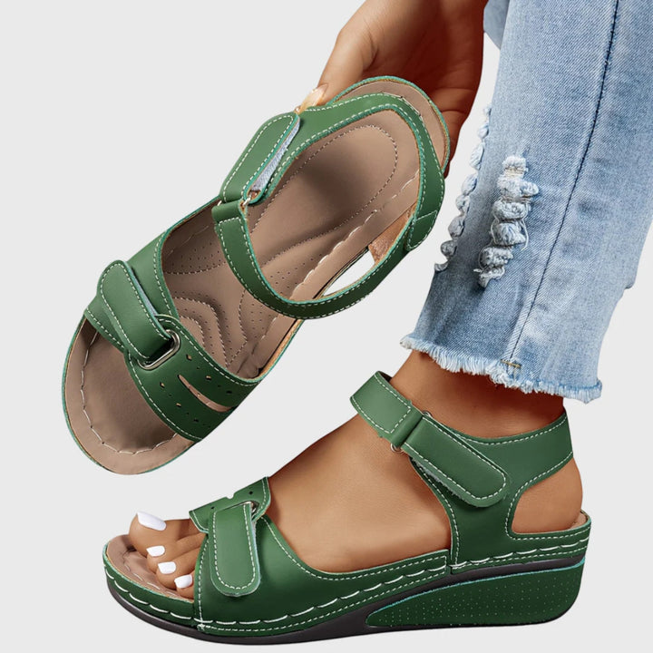 Elegant open-toe women's wedge sandals, featuring comfortable adjustable straps for a perfect fit.