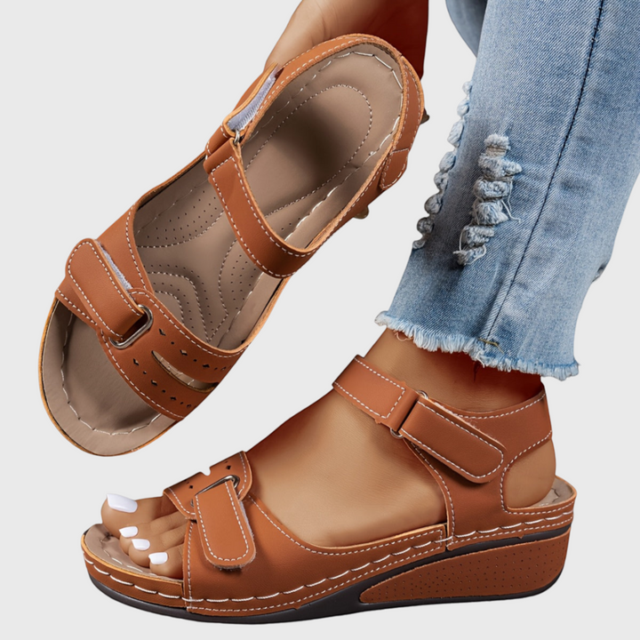 Stylish women's wedge sandals with comfortable adjustable straps, perfect for elegant and casual summer outfits.