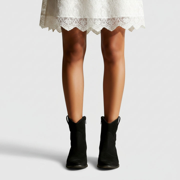 Stylish women's western ankle boots with a comfortable flat heel, perfect for fashion.