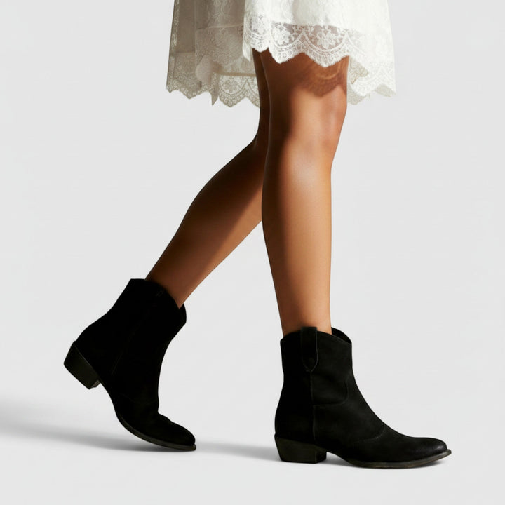 Women's comfortable ankle boots with a flat heel, versatile western style for all-day comfort.