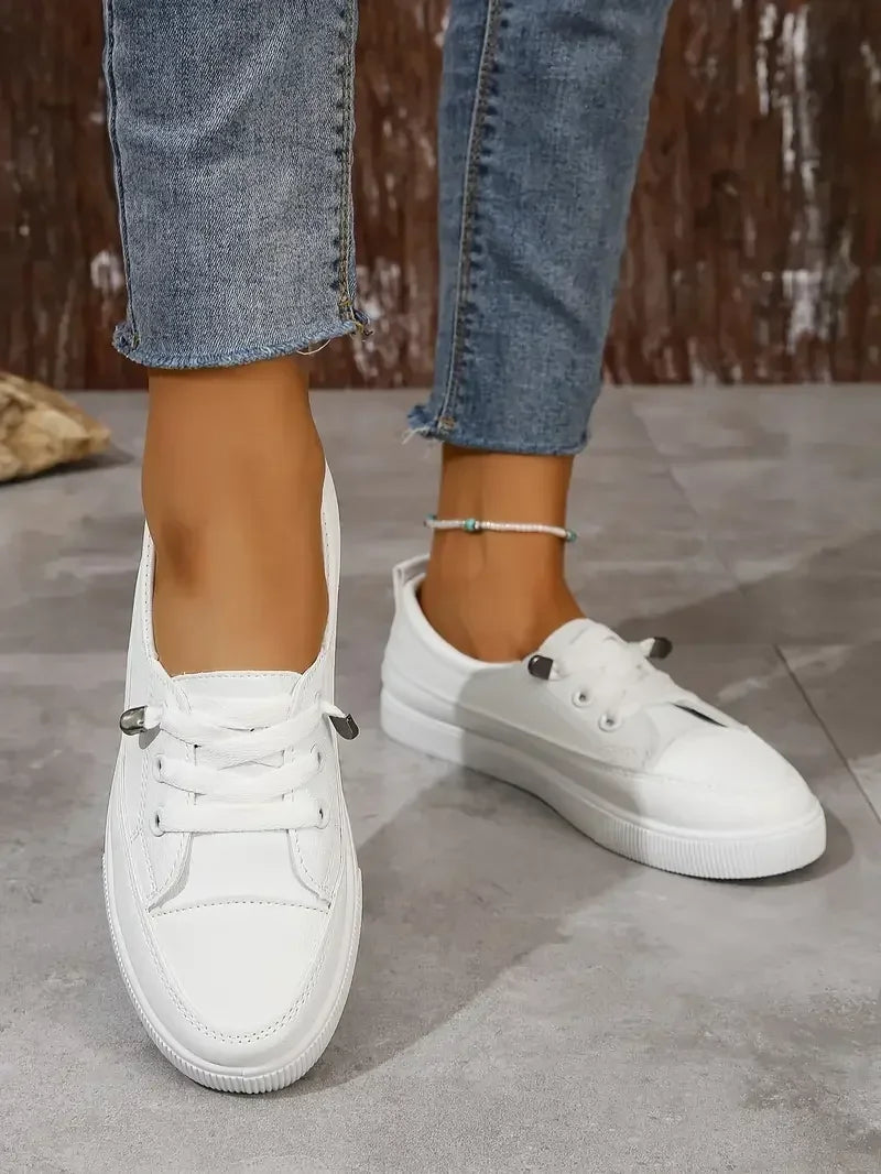 White women's round toe lace-up flats, ideal for everyday casual wear. Stylish and comfortable women's shoes.