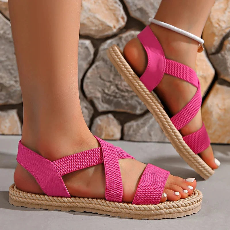 Lightweight women's espadrille sandals, featuring a woven upper, elastic straps, and a comfortable braided sole.