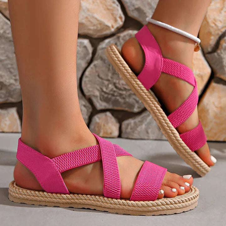 Lightweight women's espadrille sandals, featuring a woven upper, elastic straps, and a comfortable braided sole.