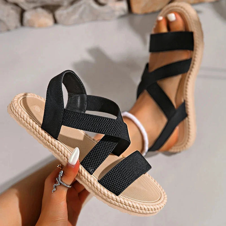 Chic women's espadrille sandals with a comfortable woven design, criss-cross elastic straps & braided sole.