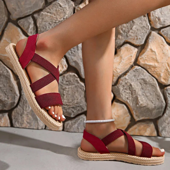 Stylish women's holiday sandals with a comfortable woven espadrille sole and elastic criss-cross straps.