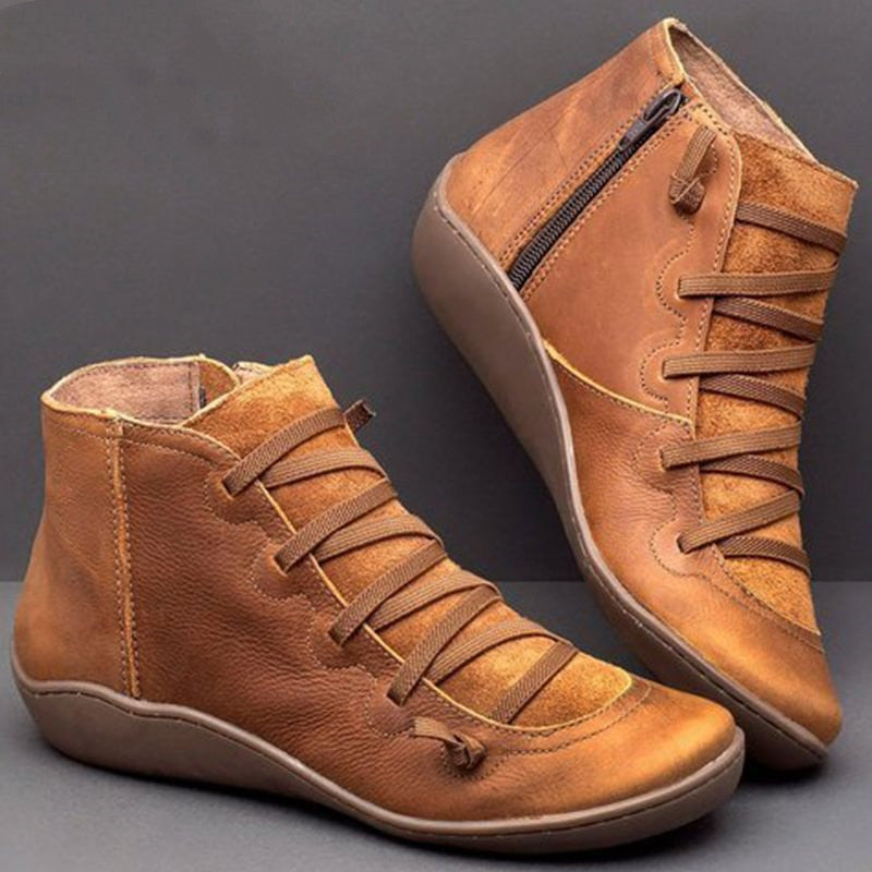 Comfortable women's zip ankle boots, black PU leather, flat heel, providing essential orthopedic foot support.