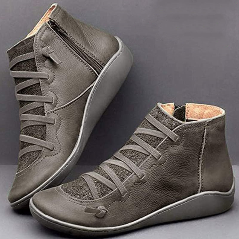 Luxe black PU leather orthopedic ankle boots for women, offering posture correction and all-day comfort with a zip.