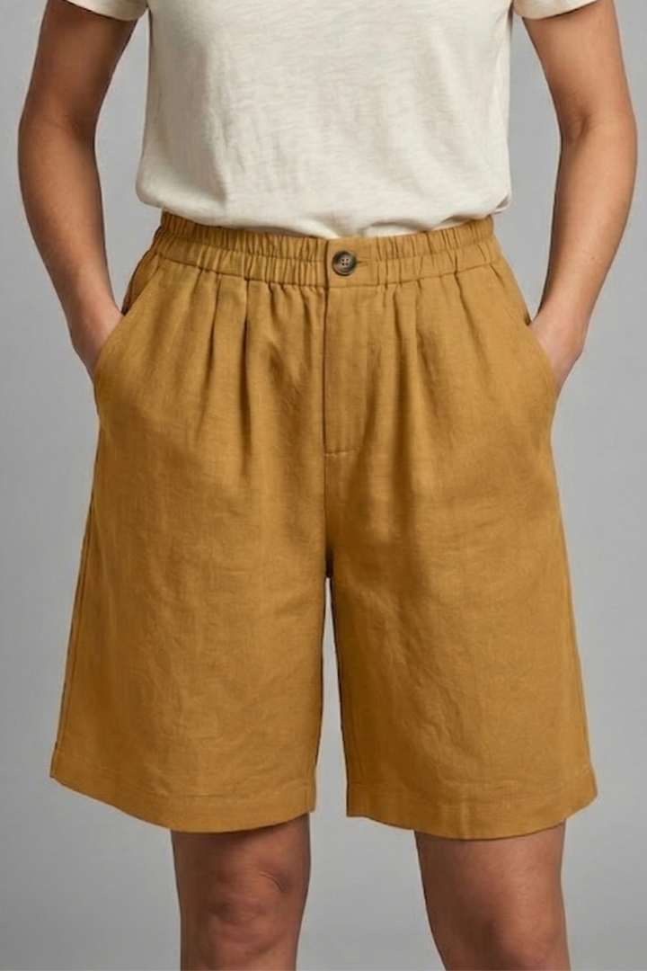 Multi-use women's shorts with elastic waist & side pockets; great for active, casual, or lounge wear.