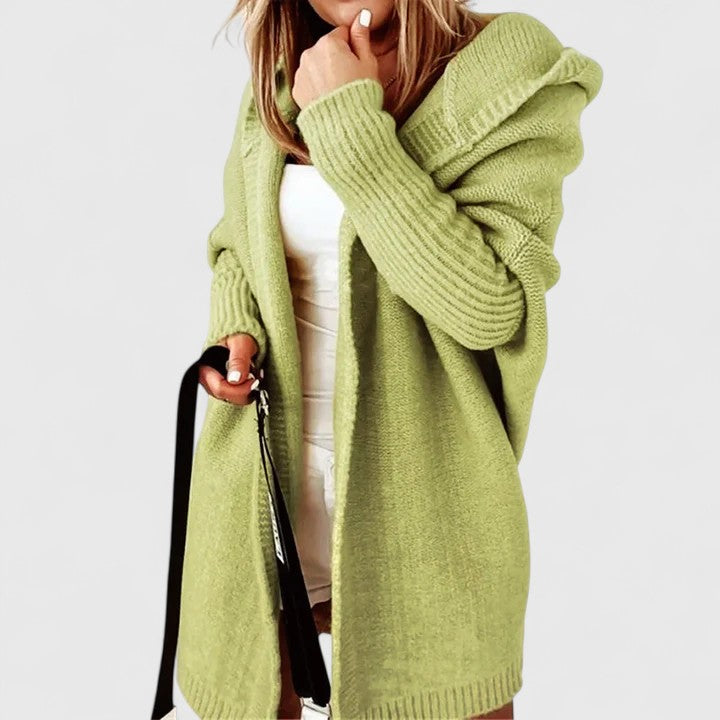 Comfy women's hooded knit cardigan, oversized fit & knee-length. A cozy, long sleeve layering piece for cooler weather.