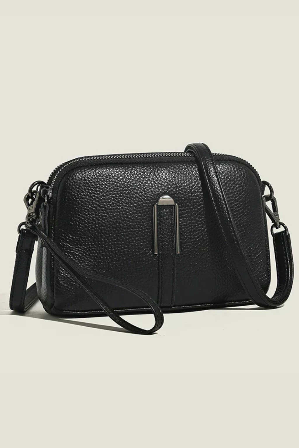 Women's versatile compact shoulder & crossbody bag, secure double zip and elegant textured design.
