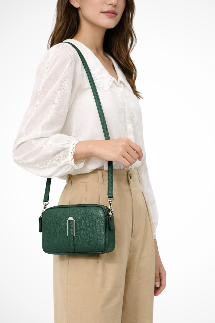 Chic women's crossbody purse with a textured finish & practical double zip, ideal for daily essentials.
