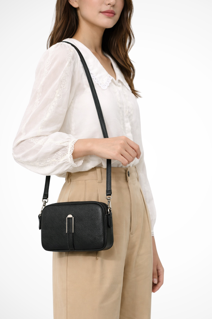 Stylish double zip women's compact crossbody bag, featuring a unique textured finish for everyday use.