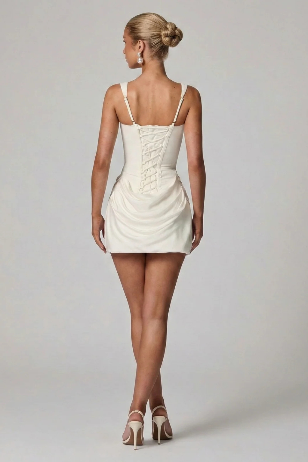 Elegant tailored fit mini dress for graduation. Women's draped corset and square neck, ideal for cocktail parties.