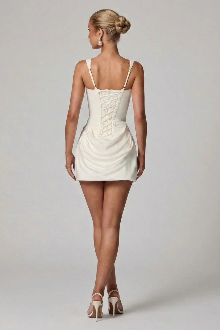 Elegant tailored fit mini dress for graduation. Women's draped corset and square neck, ideal for cocktail parties.